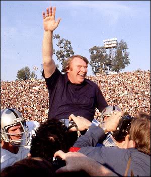 John Madden celebrating his gold medal in color commentary at the Special Olympics